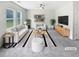 Bright living room with modern furniture, neutral colors, and natural light from large windows at 55 Cherohala Ct, Covington, GA 30016