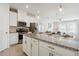 Modern kitchen with white cabinets, granite countertops and stainless steel appliances at 1456 Ridgebend Way, Mableton, GA 30126