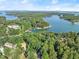 Beautiful aerial view of the lake and surrounding community, perfect for boating and lakeside living at 5775 Lakeshore Dr, Buford, GA 30518