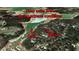 Unique aerial view showing the house's location with a private dock and guaranteed deep water at 5775 Lakeshore Dr, Buford, GA 30518