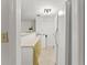 Basement kitchenette features appliances, white cabinets, and a breakfast bar at 5775 Lakeshore Dr, Buford, GA 30518