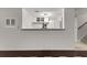 Basement kitchenette has cabinets, a sink, and a long breakfast bar at 5775 Lakeshore Dr, Buford, GA 30518