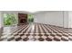 Large basement area with cozy fireplace and glass doors to the backyard at 5775 Lakeshore Dr, Buford, GA 30518