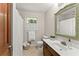 Bright bathroom with white countertops, vanity, and tile flooring, providing a clean aesthetic at 5775 Lakeshore Dr, Buford, GA 30518