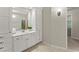 Spacious bathroom featuring a white vanity with plenty of storage at 5775 Lakeshore Dr, Buford, GA 30518