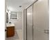 Clean bathroom featuring a glass shower door, vanity, and tiled floor at 5775 Lakeshore Dr, Buford, GA 30518