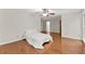 A spacious bedroom with hardwood floors and neutral paint at 5775 Lakeshore Dr, Buford, GA 30518