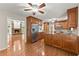 Gourmet kitchen with stainless steel appliances, granite countertops, and an open view to the Gathering room at 5775 Lakeshore Dr, Buford, GA 30518