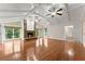 Living room features hardwood floors, vaulted ceilings, stone fireplace and large windows to let in natural light at 5775 Lakeshore Dr, Buford, GA 30518