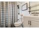 Clean bathroom with a shower/tub combo, white vanity, and modern fixtures at 980 Moreland Se Ave, Atlanta, GA 30316