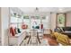 Built-in window seat dining area with glass table and colorful pillows at 980 Moreland Se Ave, Atlanta, GA 30316