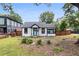 Charming white cottage with black trim and a manicured lawn at 980 Moreland Se Ave, Atlanta, GA 30316