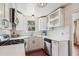 Modern white kitchen with stainless steel appliances and quartz countertops at 980 Moreland Se Ave, Atlanta, GA 30316