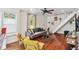 Living room with hardwood floors, gray sofa, and yellow armchairs at 980 Moreland Se Ave, Atlanta, GA 30316