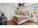 Main bedroom with hardwood floors, a large bed, and plenty of natural light at 980 Moreland Se Ave, Atlanta, GA 30316