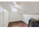 Large attic storage space with wood flooring and ample hanging space at 980 Moreland Se Ave, Atlanta, GA 30316