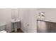 Small bathroom with pedestal sink and toilet at 608 Kimberwick Dr, Locust Grove, GA 30248