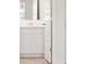 White bathroom vanity with additional storage space at 608 Kimberwick Dr, Locust Grove, GA 30248
