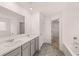 Double vanity bathroom with gray cabinets at 608 Kimberwick Dr, Locust Grove, GA 30248
