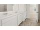 Bathroom with double vanity and marble countertop at 608 Kimberwick Dr, Locust Grove, GA 30248