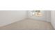 Bright bedroom with carpeted floor and large window at 608 Kimberwick Dr, Locust Grove, GA 30248