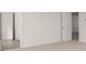 Spacious bedroom with neutral carpeting and access to bathroom at 608 Kimberwick Dr, Locust Grove, GA 30248