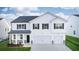 Two-story house with white siding, gray roof, and a two-car garage at 608 Kimberwick Dr, Locust Grove, GA 30248
