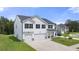 Two story house with white siding, gray roof and a three-car garage at 608 Kimberwick Dr, Locust Grove, GA 30248