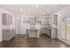 Kitchen with gray cabinets, granite countertops, and an island at 608 Kimberwick Dr, Locust Grove, GA 30248