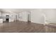 Modern kitchen with island open to spacious living room at 608 Kimberwick Dr, Locust Grove, GA 30248