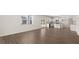 Open living room with hardwood floors and kitchen access at 608 Kimberwick Dr, Locust Grove, GA 30248
