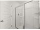 Large walk-in shower with glass enclosure at 608 Kimberwick Dr, Locust Grove, GA 30248