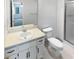 Functional bathroom with a vanity, toilet, framed mirror, and a glass-enclosed shower stall at 7131 Forest Ln, Union City, GA 30291