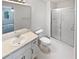 Bathroom with a single sink vanity and a glass enclosed shower at 7131 Forest Ln, Union City, GA 30291