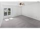 Bedroom featuring a ceiling fan, closet, and large windows to let in natural light at 7131 Forest Ln, Union City, GA 30291