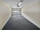 Spacious garage with ample room for parking and storage, and a large door with glass panels at 7131 Forest Ln, Union City, GA 30291