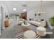 Bright living room featuring a vaulted ceiling, skylights, and a stylish fireplace at 7131 Forest Ln, Union City, GA 30291