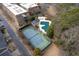 Aerial view of the tennis court and community pool with a gazebo in a wooded area at 905 Freedom Ln, Roswell, GA 30075
