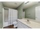 Full bathroom with tub, shower, vanity, and wood look flooring at 905 Freedom Ln, Roswell, GA 30075