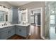 The bathroom features double sinks and glass shower, perfect for busy mornings at 905 Freedom Ln, Roswell, GA 30075