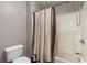 Bathroom featuring a shower and toilet at 905 Freedom Ln, Roswell, GA 30075