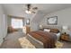 Bedroom with seating area and light neutral decor at 905 Freedom Ln, Roswell, GA 30075