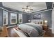 Tastefully decorated bedroom with hardwood flooring and a big window letting in ample light at 905 Freedom Ln, Roswell, GA 30075