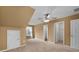Large bedroom showcasing the carpet floors and a neutral color scheme at 905 Freedom Ln, Roswell, GA 30075
