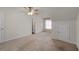 Carpeted bedroom showing a door and window at 905 Freedom Ln, Roswell, GA 30075