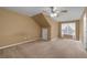 Bedroom with a large window and neutral carpet, offering a cozy and inviting atmosphere at 905 Freedom Ln, Roswell, GA 30075