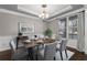 Elegant dining room with table set for six and ample natural light at 905 Freedom Ln, Roswell, GA 30075