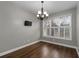 Dining room with hardwood floors, chandelier and a large window at 905 Freedom Ln, Roswell, GA 30075