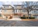 Charming multi-level townhomes featuring attached garages and well-kept landscaping at 905 Freedom Ln, Roswell, GA 30075
