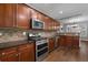 Gourmet kitchen with stainless steel appliances and abundant cabinet space at 905 Freedom Ln, Roswell, GA 30075